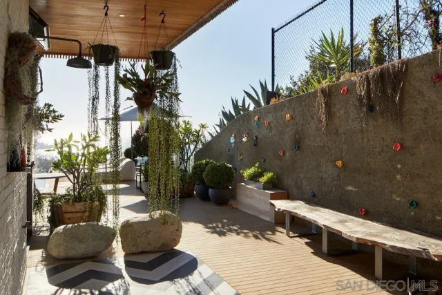 a terrace of a house with outdoor seating