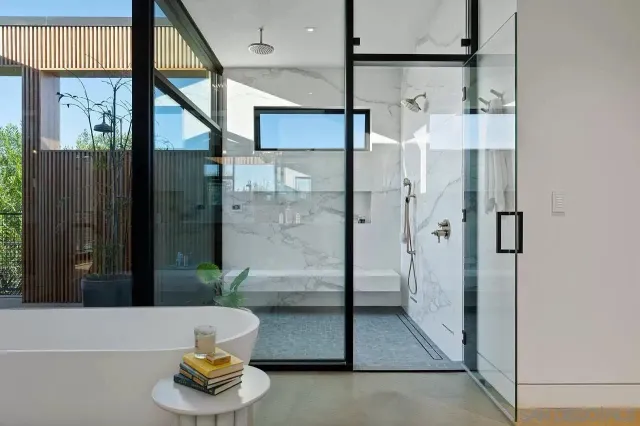 a bathroom with a tub and shower