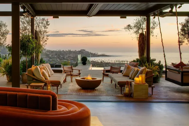 a outdoor sitting area with furniture and view of lake