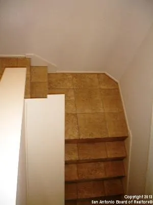 a kitchen with stainless steel appliances granite countertop a refrigerator and a stove