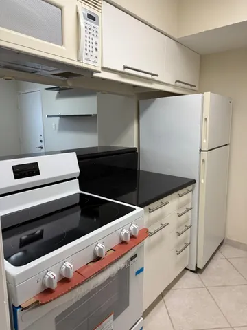 a close view of stove and microwave