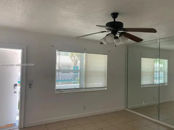 a view of a room that has a window in it