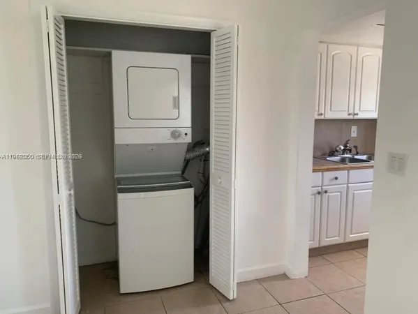 a view of room with hardwood floor and window