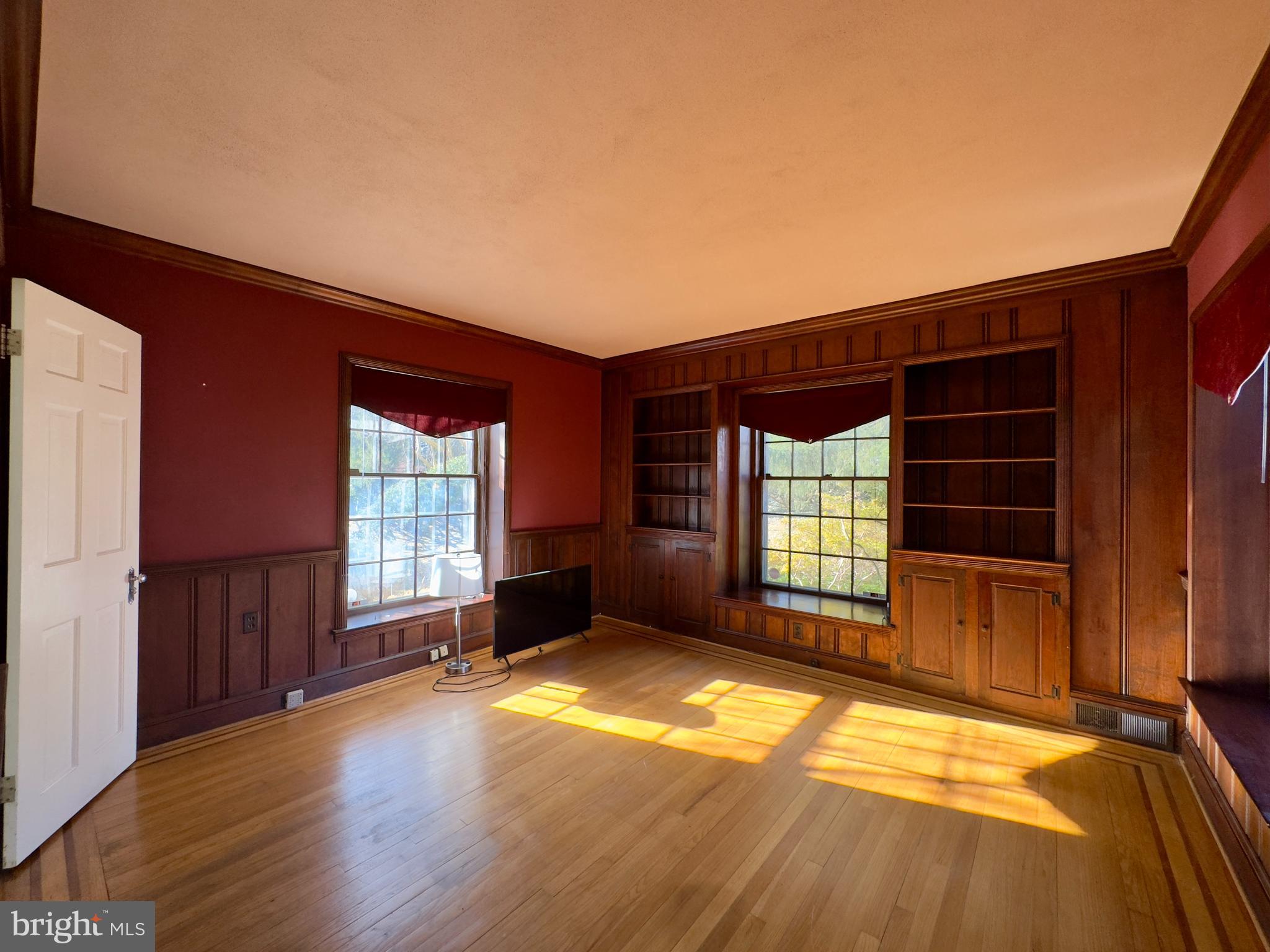 5113 North Charles Street Baltimore, MD 21210 - Photo 9 of 34 a view of empty room with wooden floor and fan