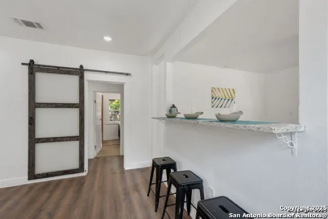 a view of workspace with wooden floor