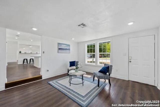 a living room with furniture and a table