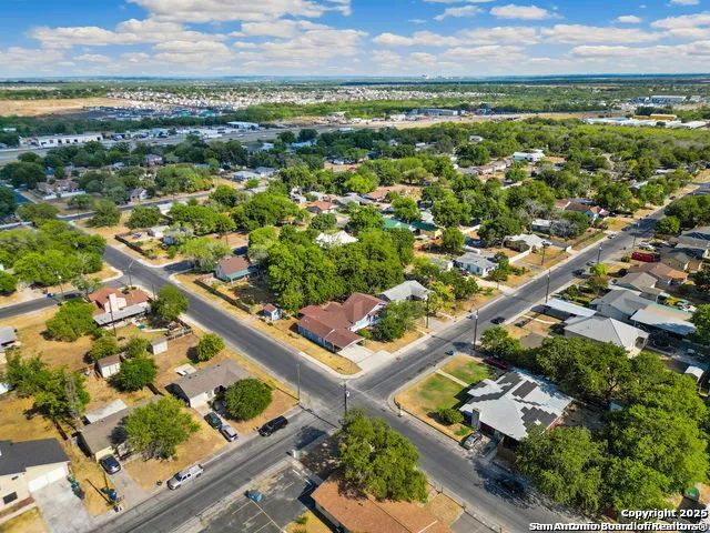 an aerial view of residential houses with outdoor space