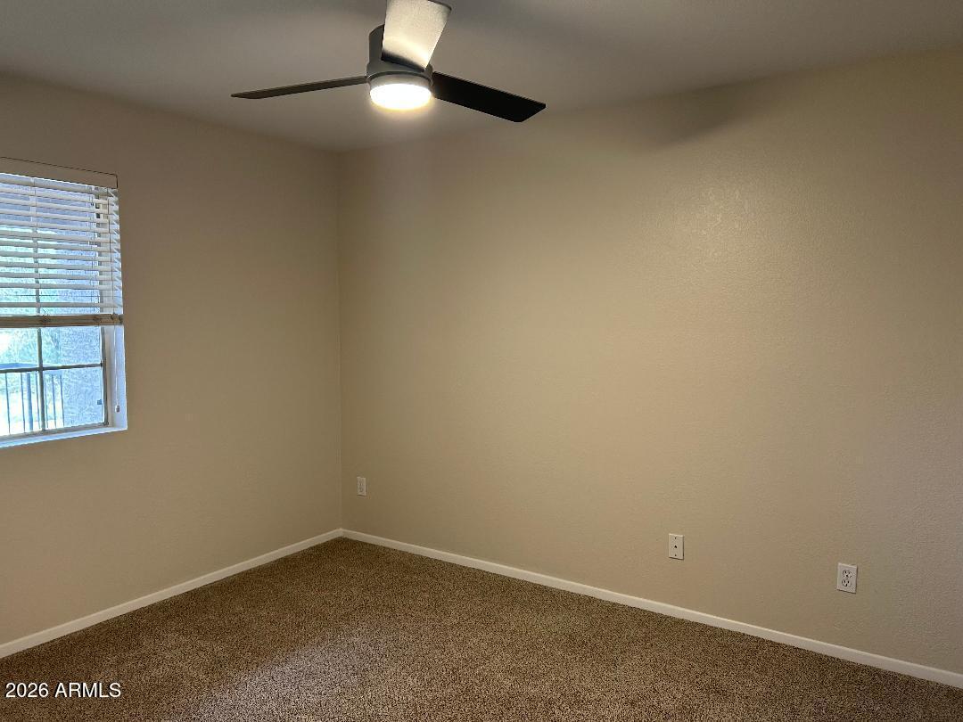 1720 East Thunderbird Road, Unit 2068 Phoenix, AZ 85022 - Photo 6 of 10 an empty room with a window