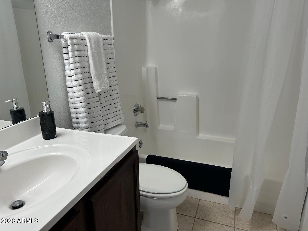 1720 East Thunderbird Road, Unit 2068 Phoenix, AZ 85022 - Photo 7 of 10 a bathroom with a sink a toilet and shower