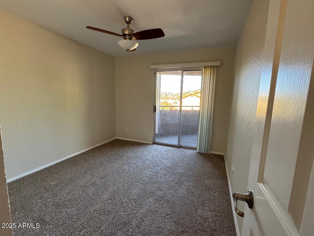 1720 East Thunderbird Road, Unit 2068 Phoenix, AZ 85022 - Photo 9 of 10 a view of an empty room and a window