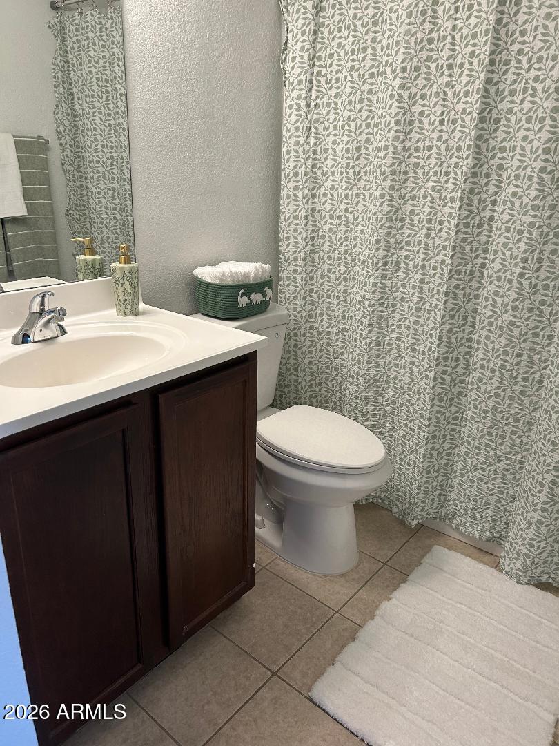 1720 East Thunderbird Road, Unit 2068 Phoenix, AZ 85022 - Photo 10 of 10 a bathroom with a sink toilet and a mirror