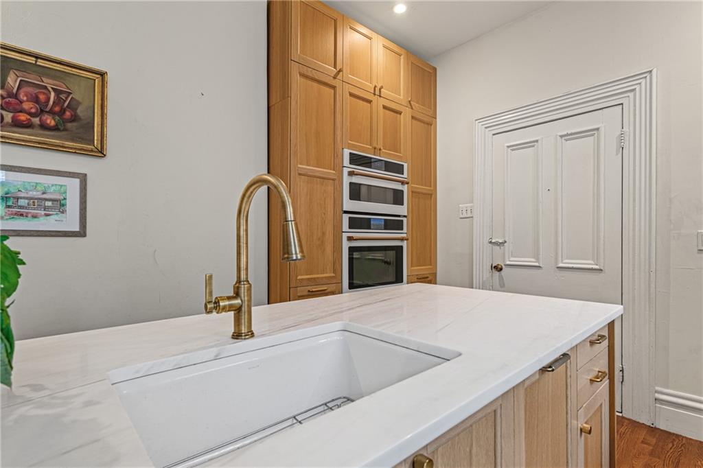 657 Maple Lane Sewickley, PA 15143 - Photo 16 of 50 Large center island with sink makes a great prep space.