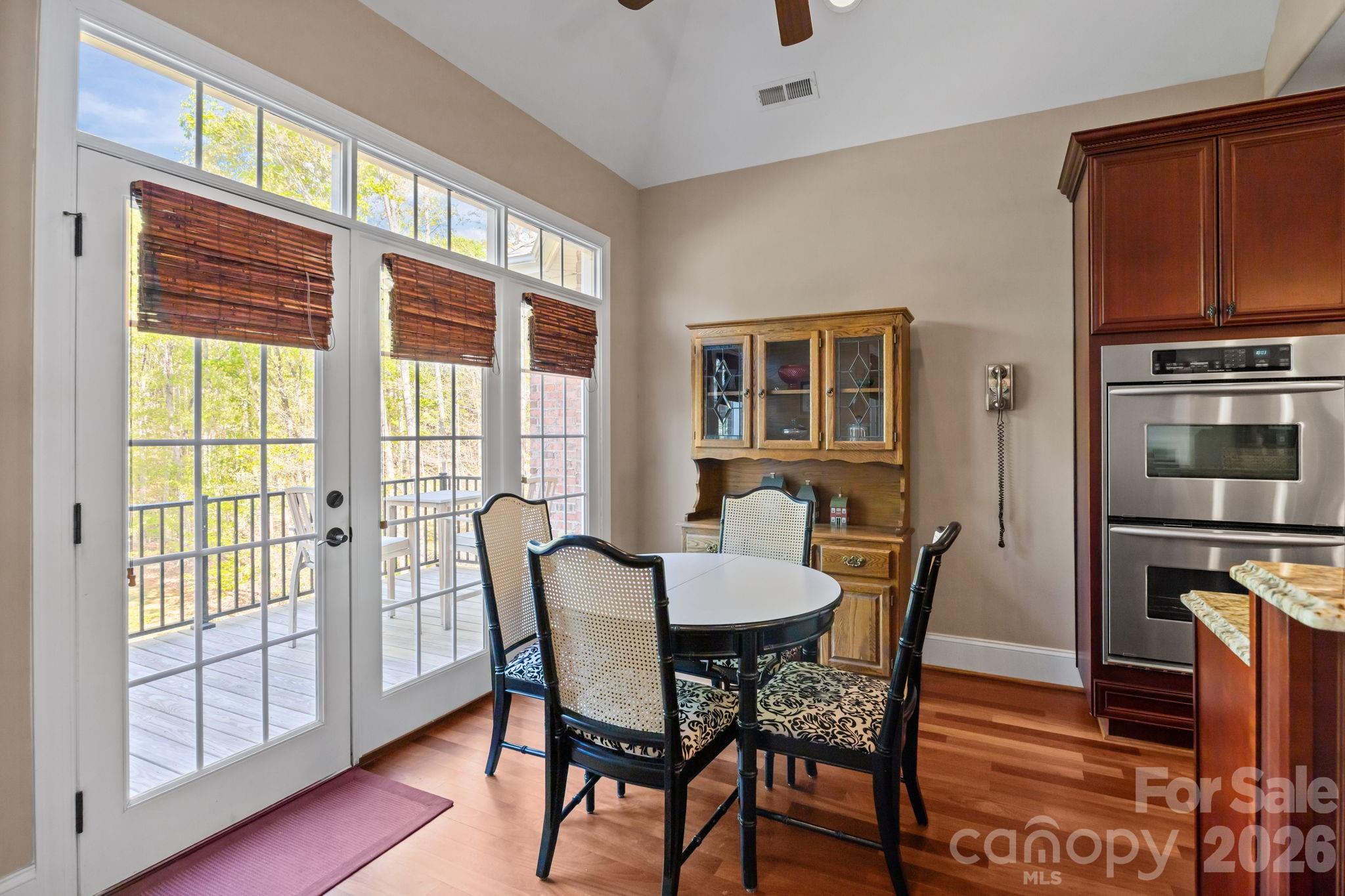 120 Laurel Ridge Drive Statesville, NC 28677 - Photo 11 of 48 a view of a dining room with furniture window and wooden floor
