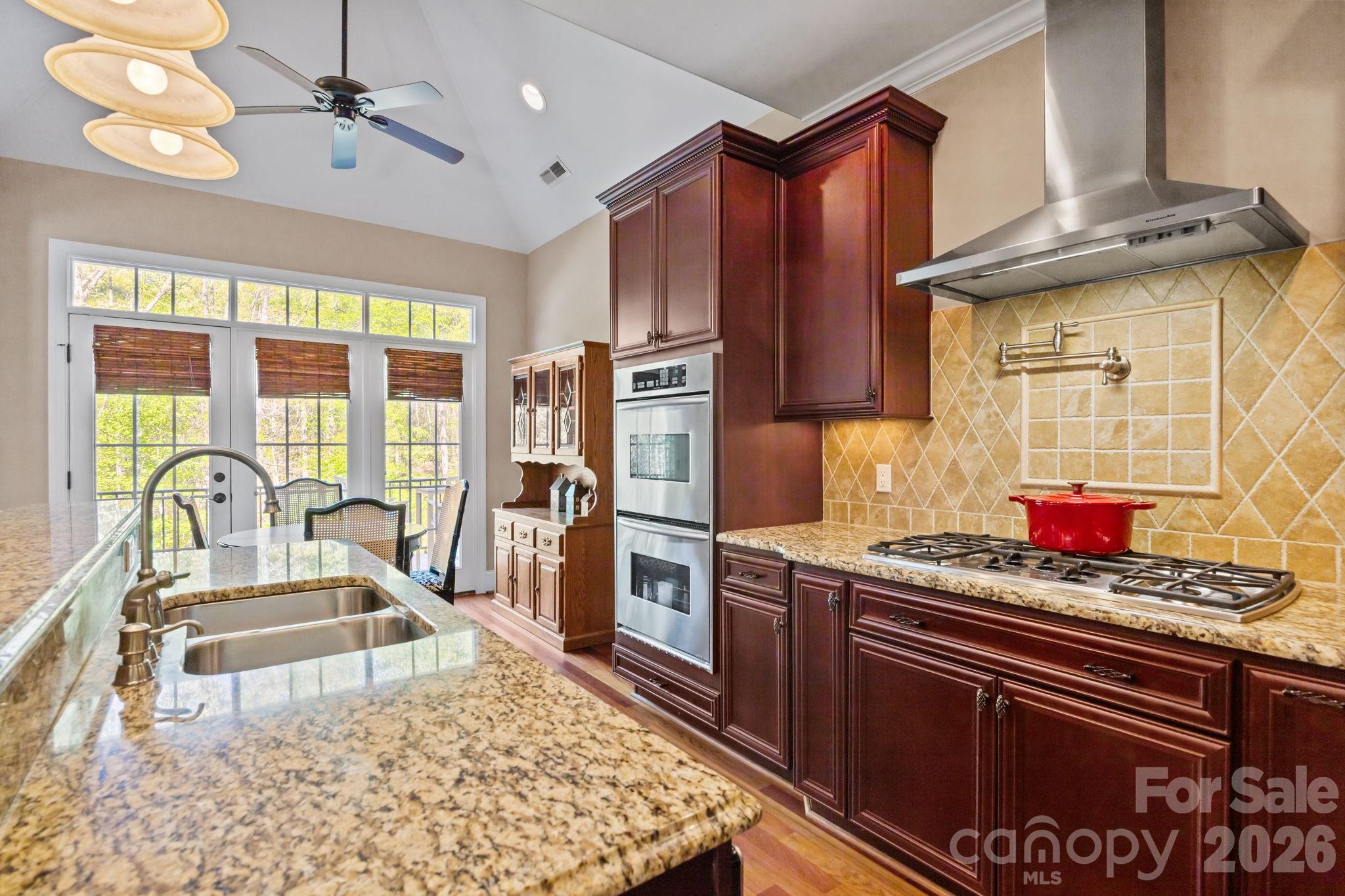 120 Laurel Ridge Drive Statesville, NC 28677 - Photo 15 of 48 a kitchen with stainless steel appliances granite countertop a stove a sink and a refrigerator