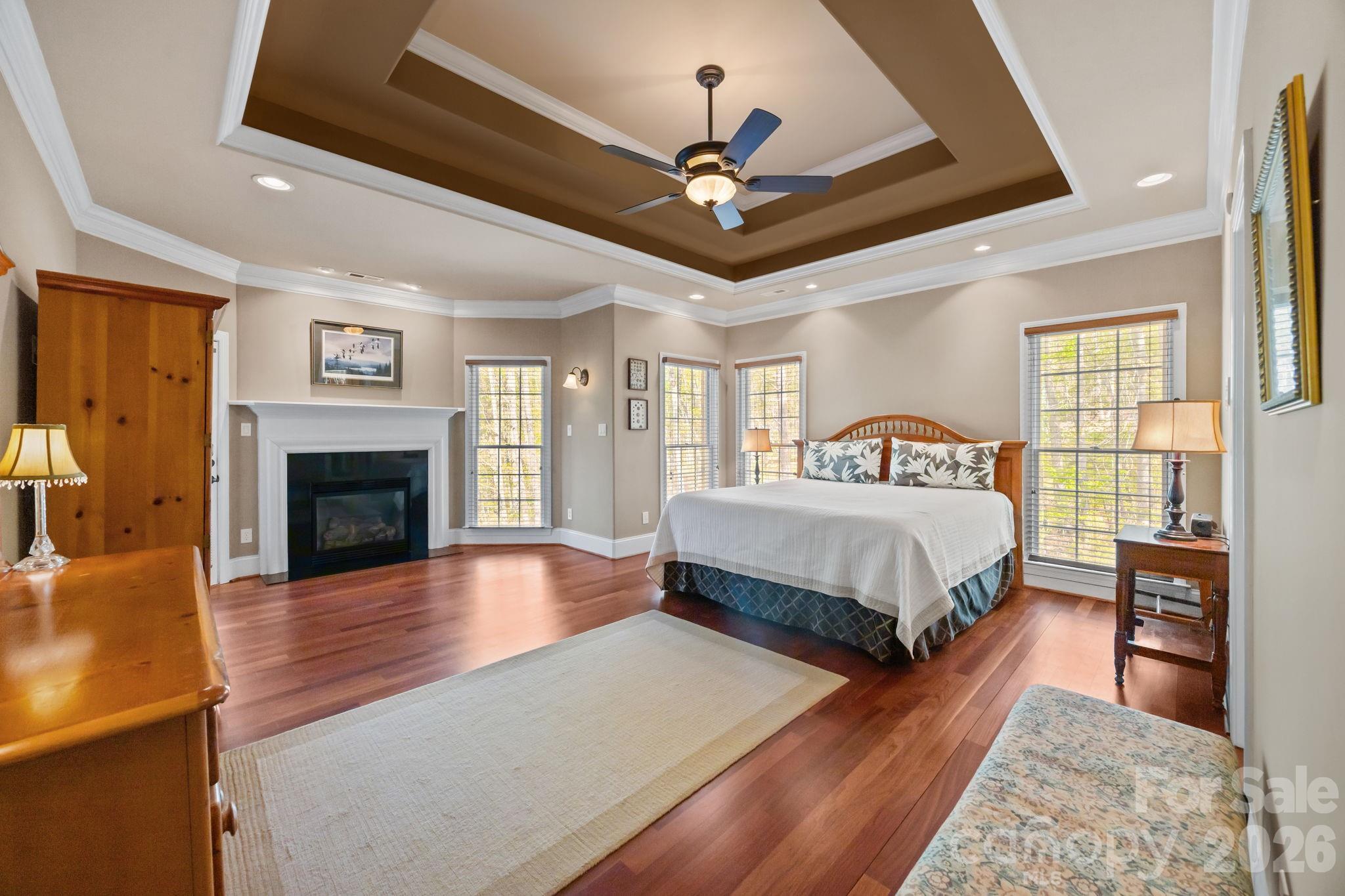 120 Laurel Ridge Drive Statesville, NC 28677 - Photo 16 of 48 a spacious bedroom with a bed and a fireplace