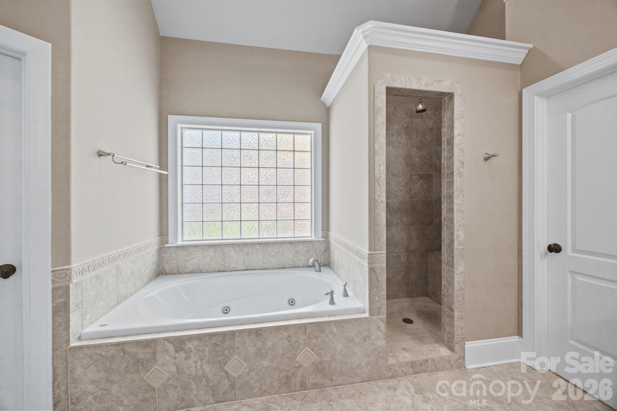 120 Laurel Ridge Drive Statesville, NC 28677 - Photo 19 of 48 a bathroom with a bathtub and shower