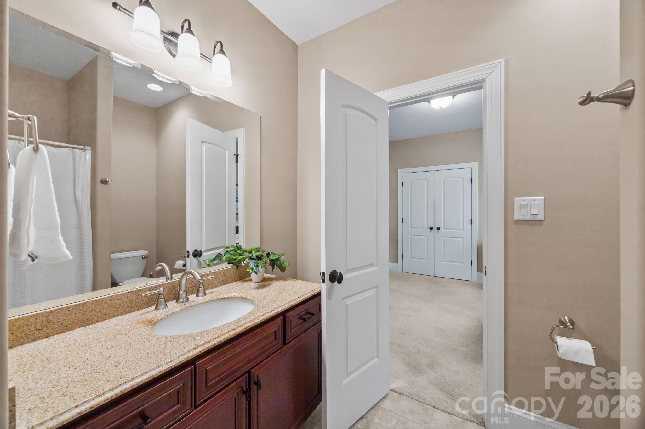 120 Laurel Ridge Drive Statesville, NC 28677 - Photo 22 of 48 a bathroom with a granite countertop sink and a mirror