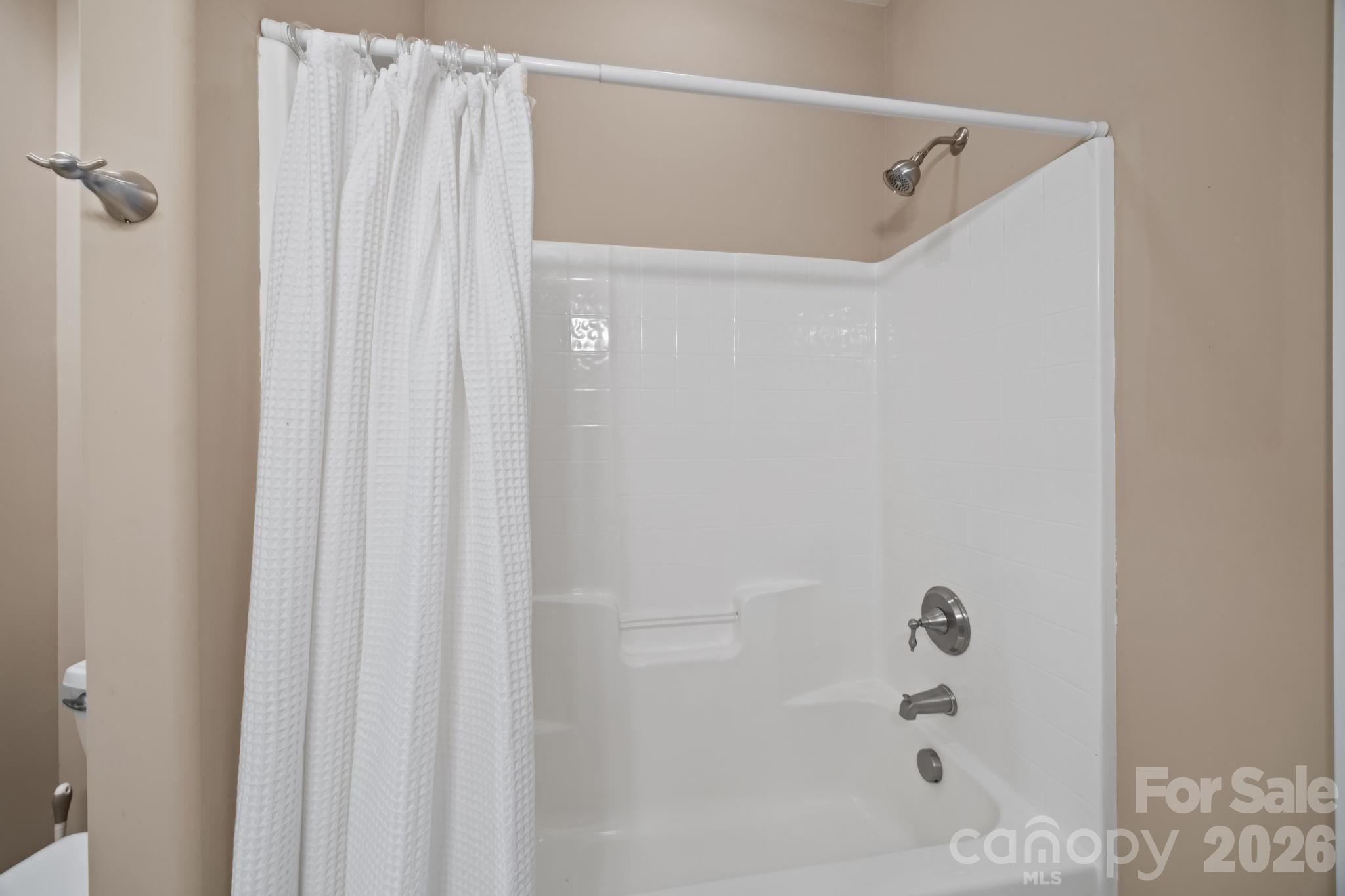 120 Laurel Ridge Drive Statesville, NC 28677 - Photo 23 of 48 a bathroom with a shower and a bath tub