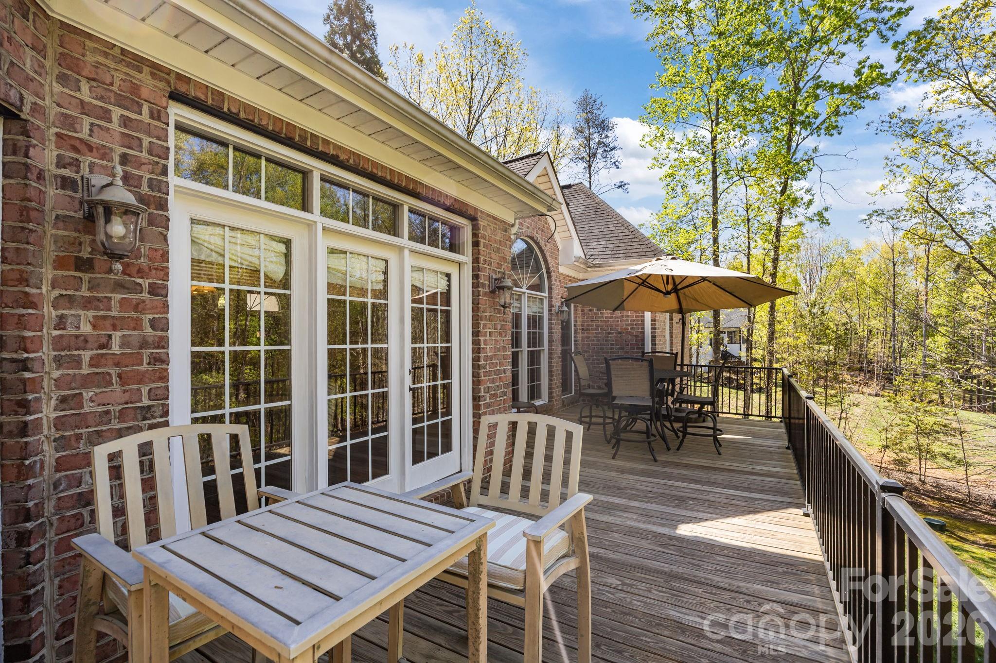 120 Laurel Ridge Drive Statesville, NC 28677 - Photo 40 of 48 a view of a patio with a table and chairs