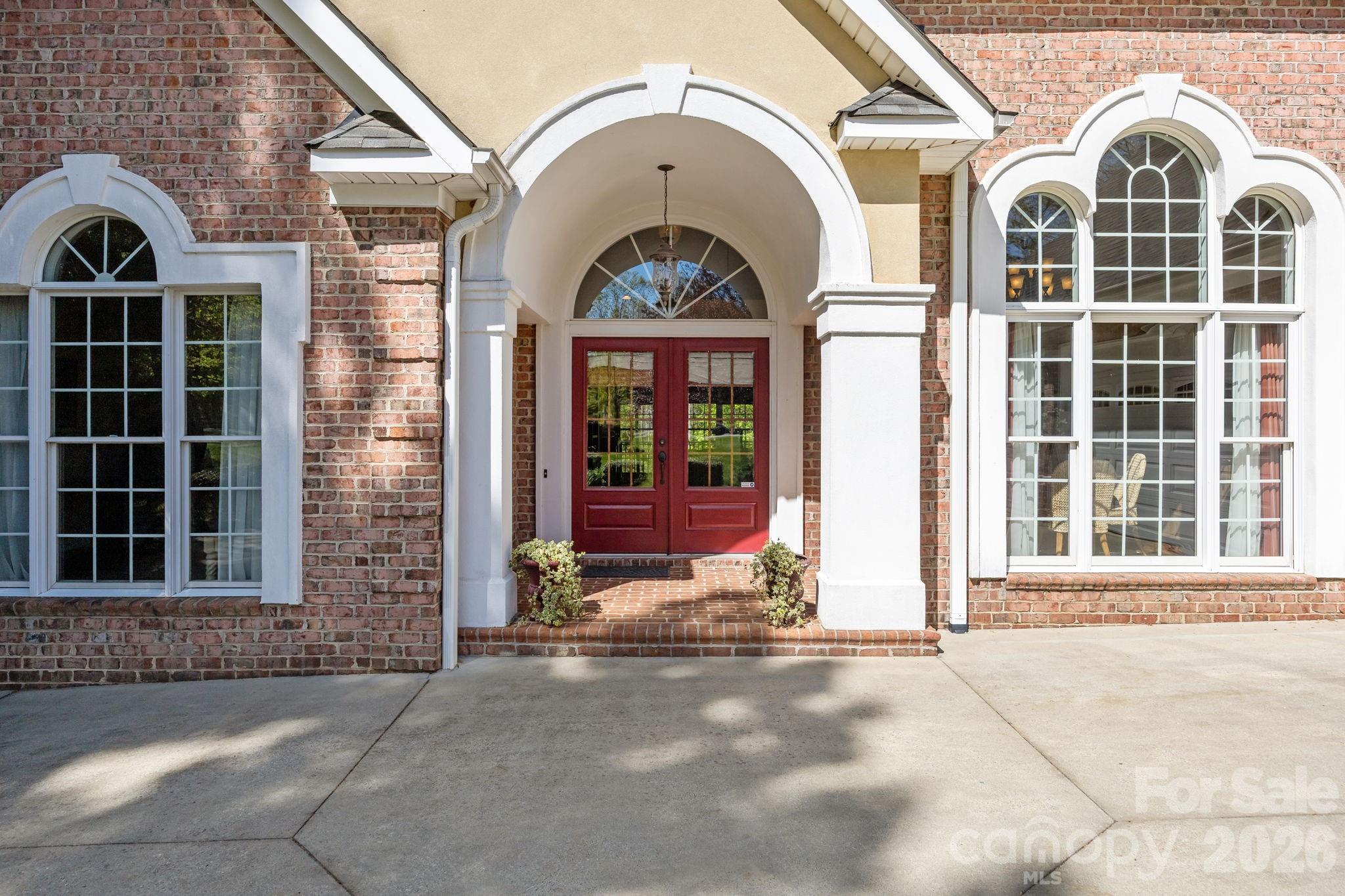 120 Laurel Ridge Drive Statesville, NC 28677 - Photo 4 of 48 a view of a brick house with large windows