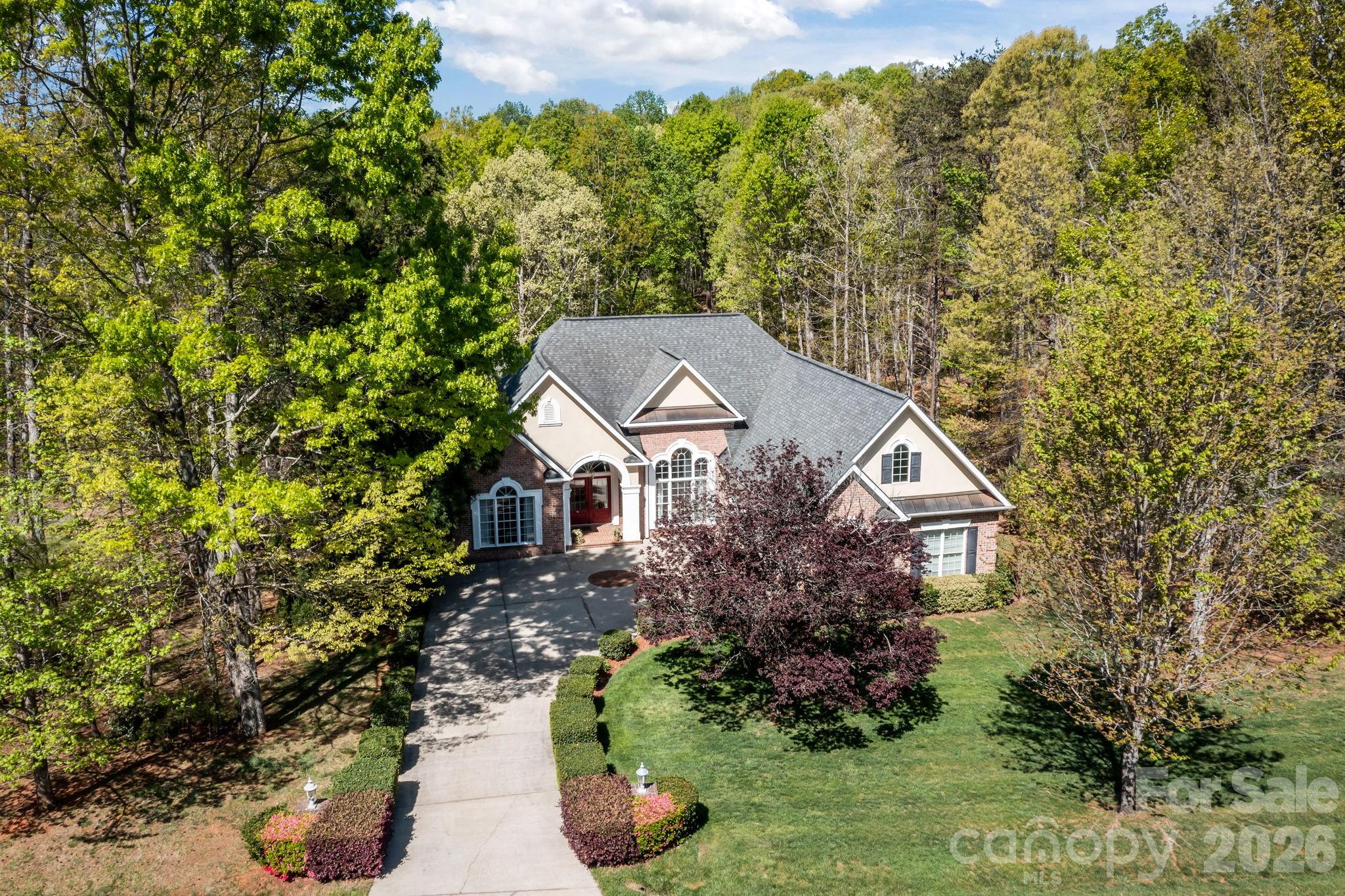 120 Laurel Ridge Drive Statesville, NC 28677 - Photo 43 of 48 a house with trees in front of it