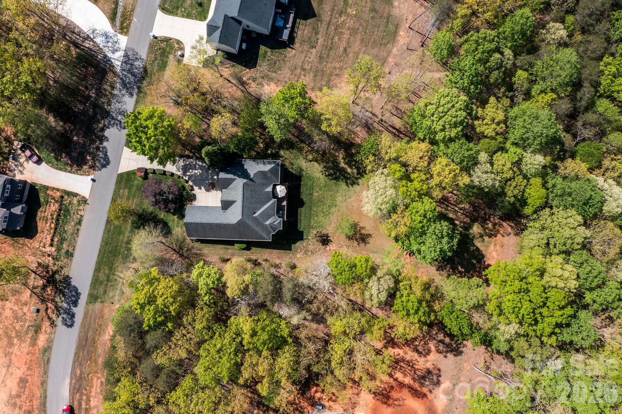 120 Laurel Ridge Drive Statesville, NC 28677 - Photo 44 of 48 a backyard of a house with a yard and outdoor seating