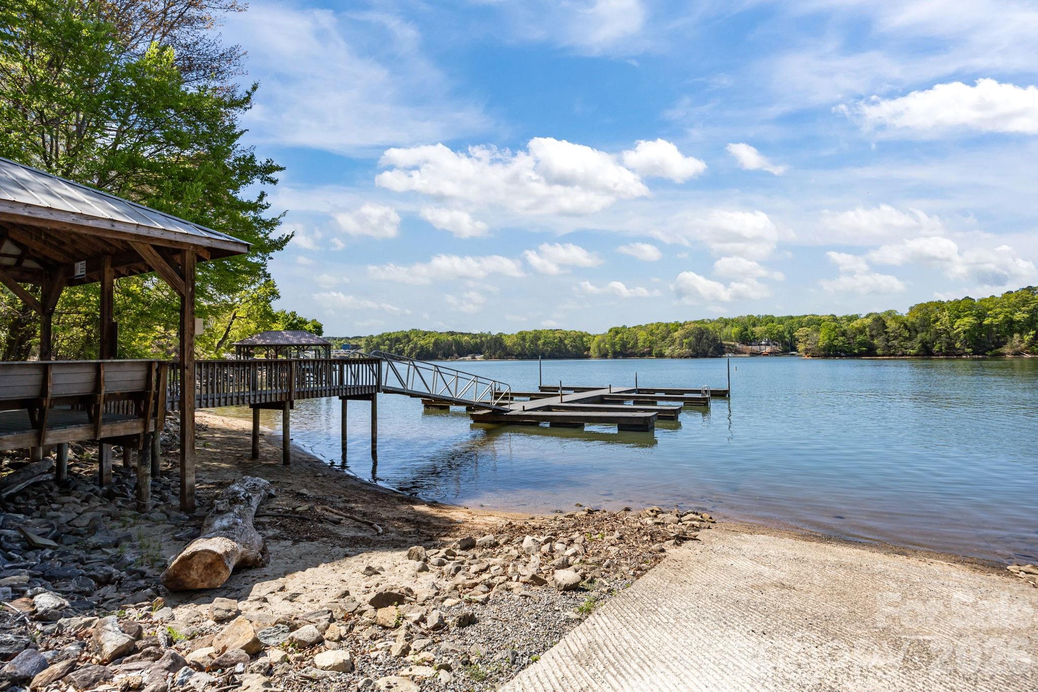 120 Laurel Ridge Drive Statesville, NC 28677 - Photo 46 of 48 a view of a lake with boats and trees in the background