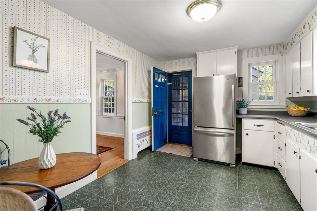 62 Longview Drive Marblehead, MA 01945 - Photo 12 of 42 a kitchen with stainless steel appliances granite countertop a refrigerator a stove a sink a counter space and cabinets