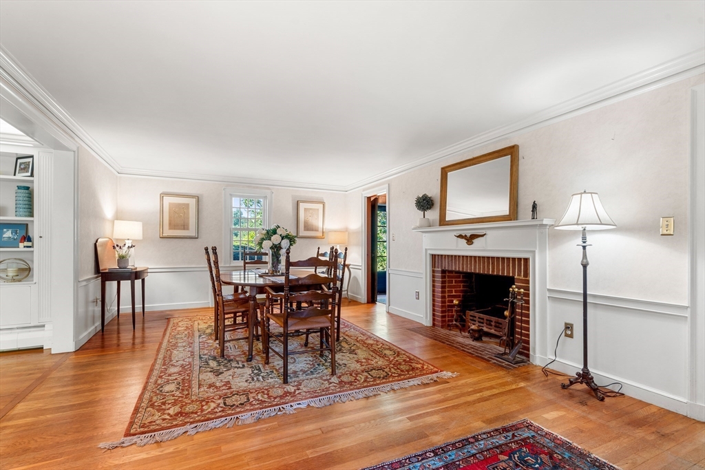 62 Longview Drive Marblehead, MA 01945 - Photo 18 of 42 a living room with furniture a fireplace and a flat screen tv
