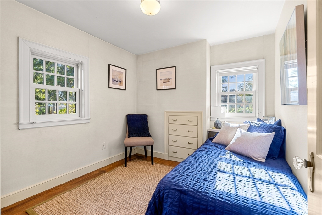 62 Longview Drive Marblehead, MA 01945 - Photo 25 of 42 a bedroom with a bed and wooden floor