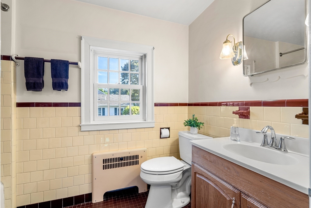 62 Longview Drive Marblehead, MA 01945 - Photo 27 of 42 a bathroom with a sink a toilet and mirror