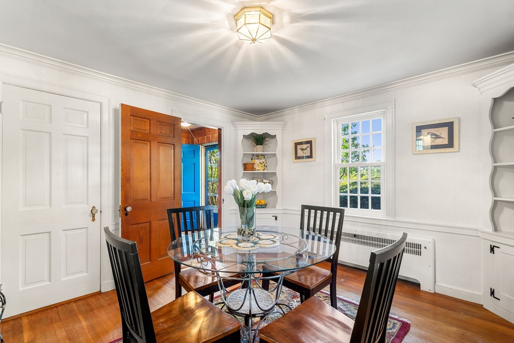 62 Longview Drive Marblehead, MA 01945 - Photo 10 of 42 a view of a dining room with furniture window and wooden floor