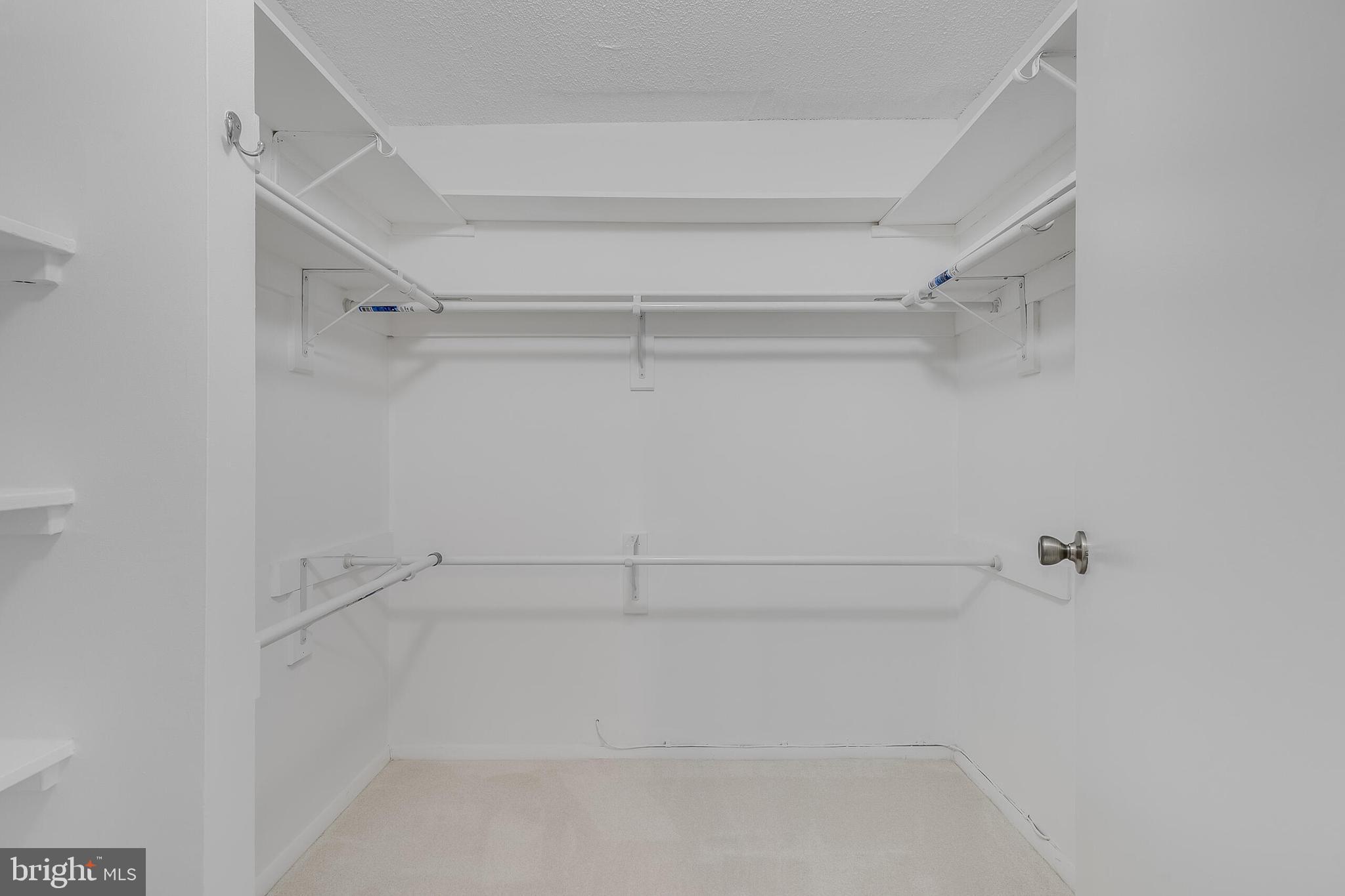 6800 Fleetwood Road, Unit 802 McLean, VA 22101 - Photo 22 of 39 Owner suite walk in closet