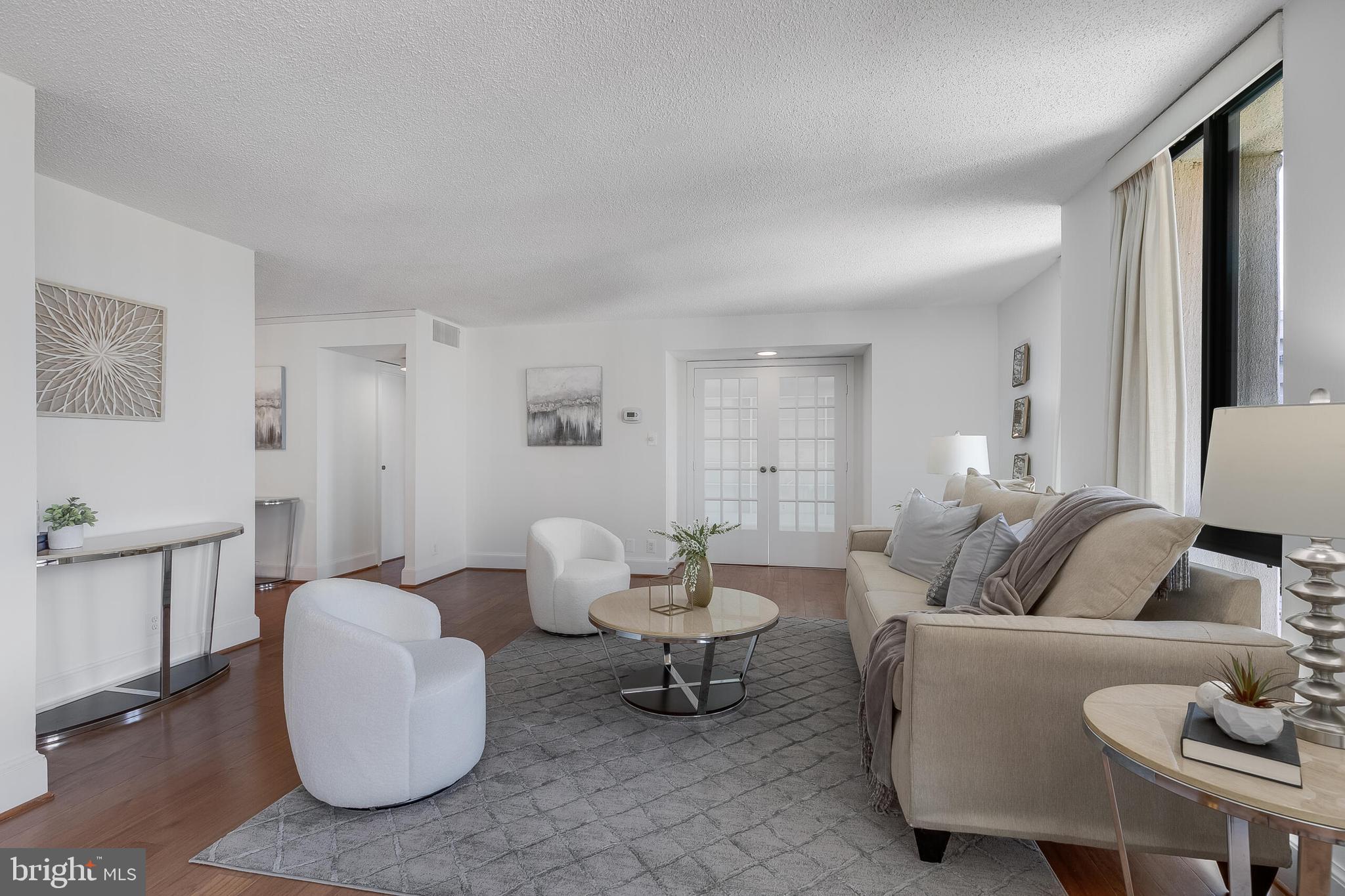 6800 Fleetwood Road, Unit 802 McLean, VA 22101 - Photo 6 of 39 Family room with french doors to den/BR #2