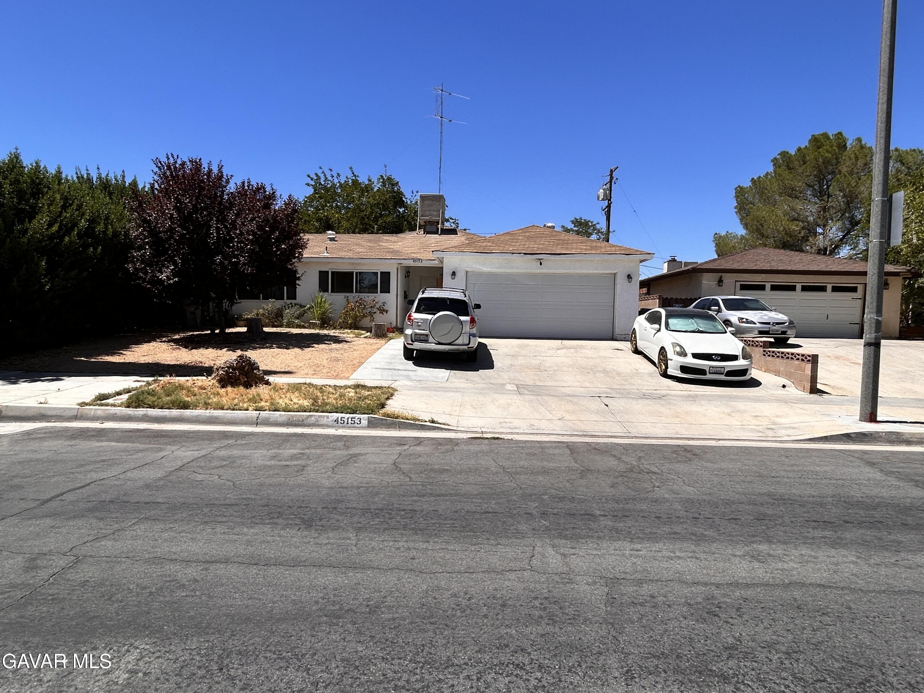 a view of a house with outdoor space and sitting area