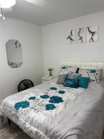 a bedroom with a bed and a couch