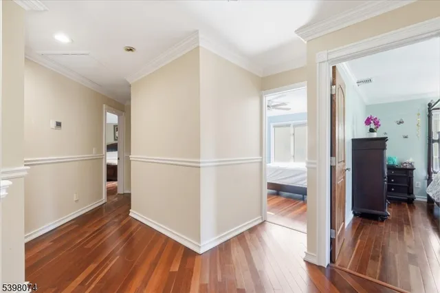 a view of hallway with wooden floor