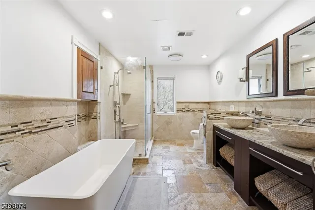 a bathroom with a sink a mirror and a bathtub