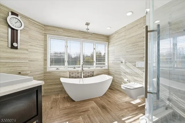 a spacious bathroom with a bathtub and window