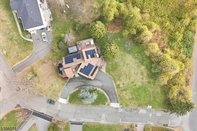 an aerial view of a house with outdoor space