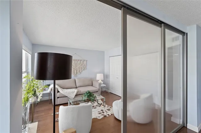 a living room with a table and chairs