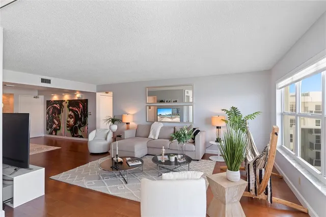 a kitchen with stainless steel appliances granite countertop a stove top oven a sink dishwasher and a microwave oven on the blue kitchen countertops