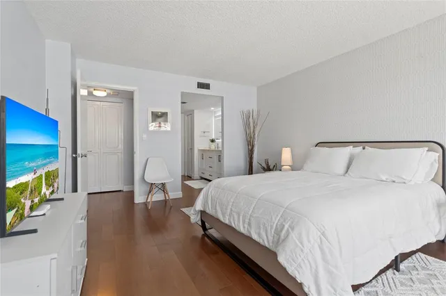 a spacious bathroom with a double vanity sink mirror and shower