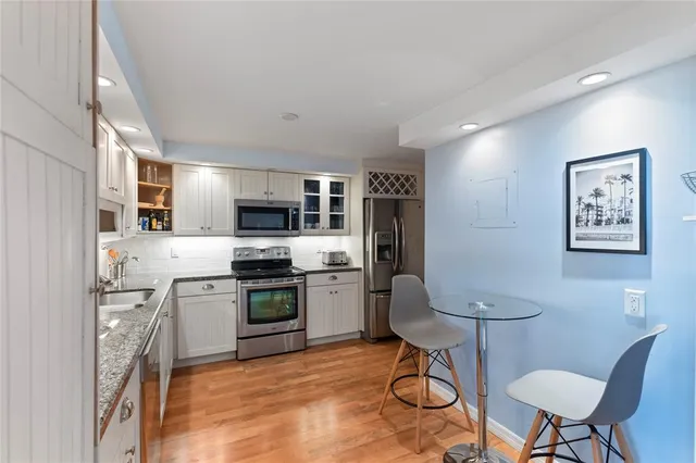 a view of a patio with a table and chairs