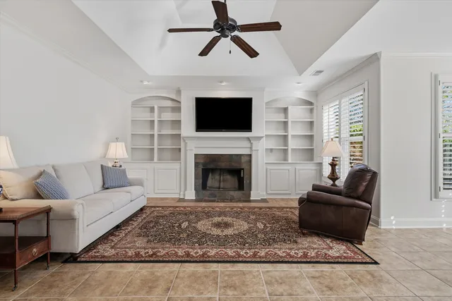 a living room with furniture and a fireplace