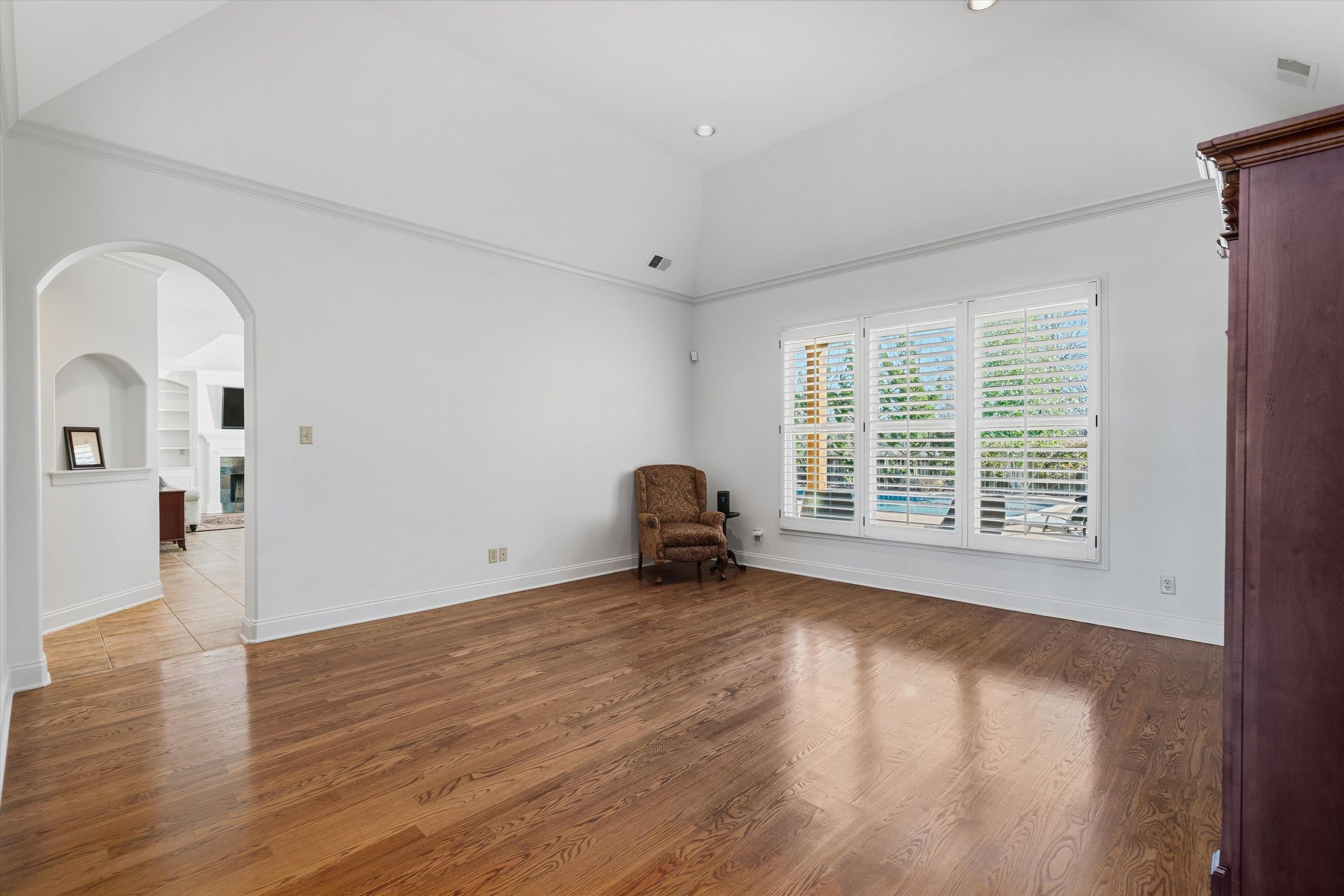 639 Critz Cove Collierville, TN 38017 - Photo 16 of 40 a view of empty room with wooden floor and fan