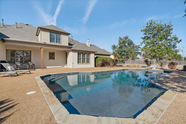 a view of a house with swimming pool