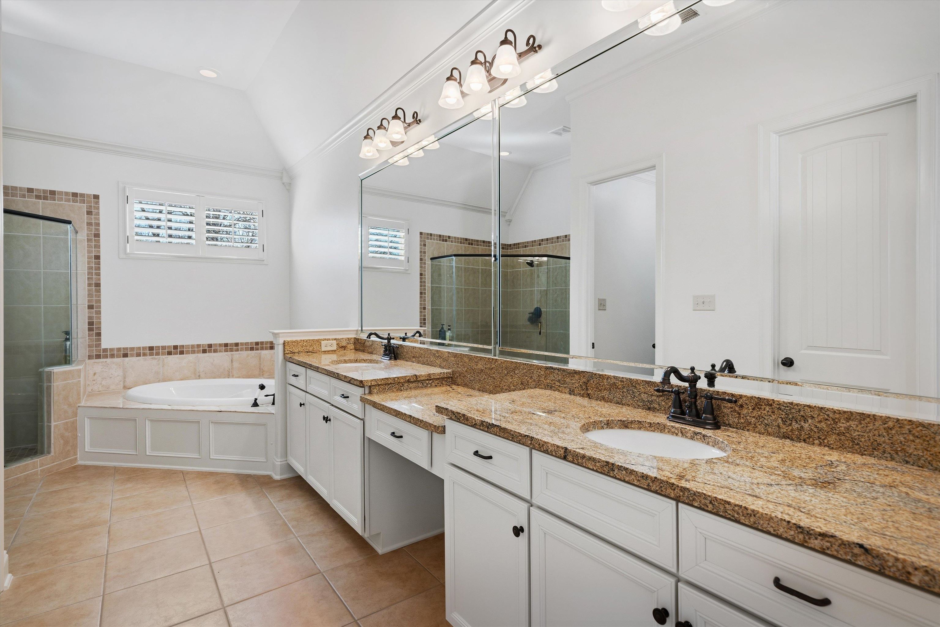 639 Critz Cove Collierville, TN 38017 - Photo 22 of 40 a bathroom with a granite countertop double vanity sink and mirror