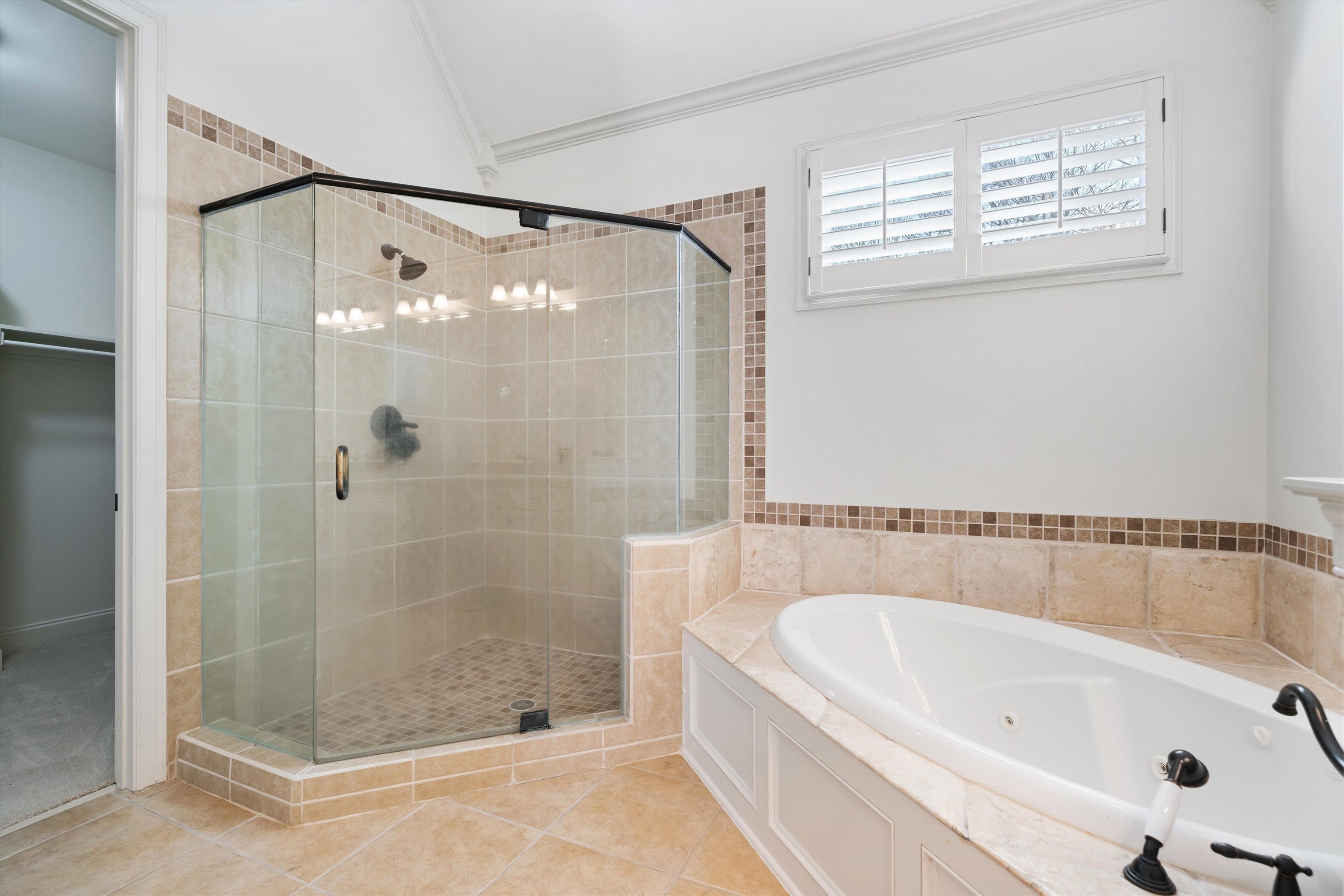 639 Critz Cove Collierville, TN 38017 - Photo 23 of 40 a bathroom with a bathtub and shower