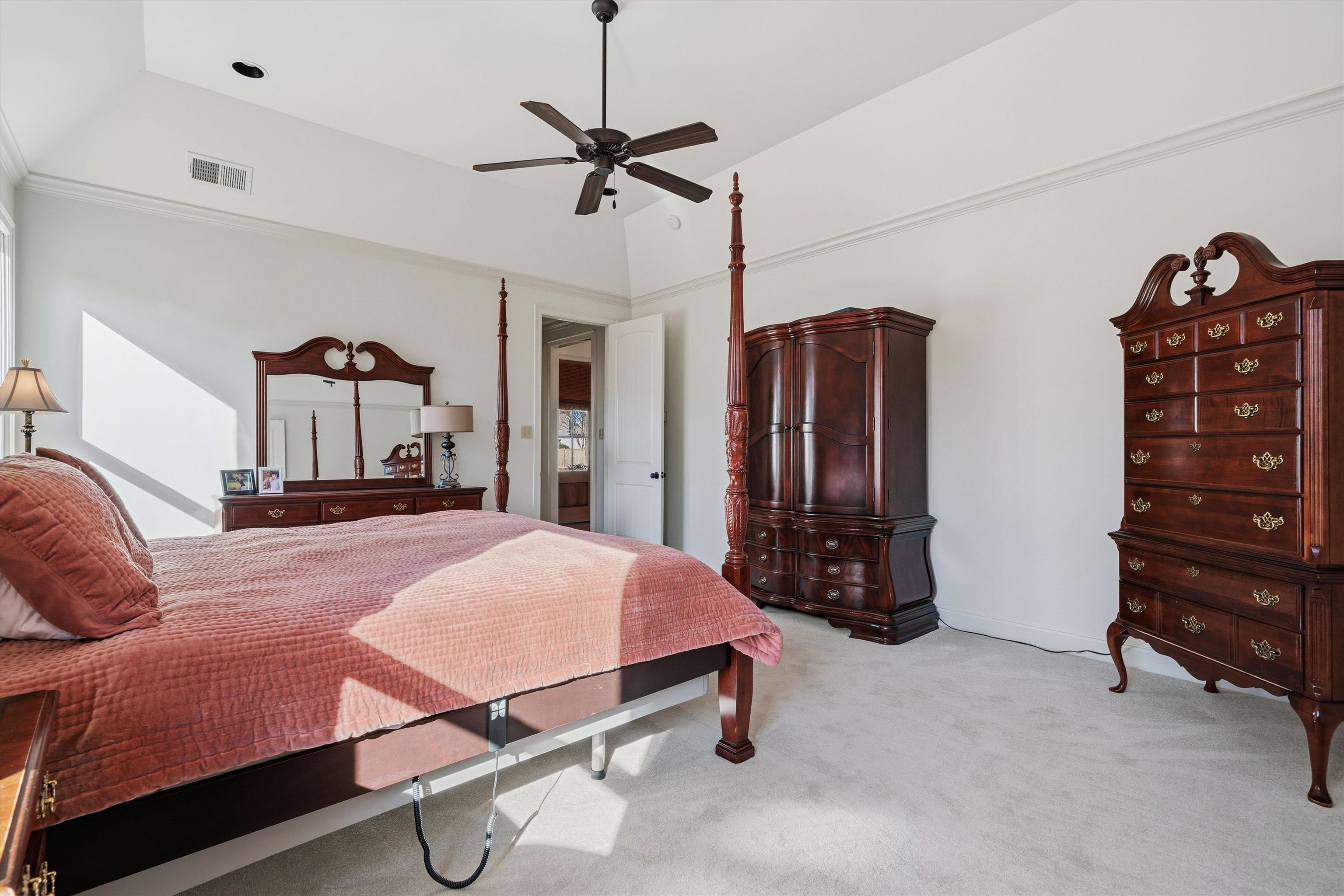 639 Critz Cove Collierville, TN 38017 - Photo 24 of 40 a bed room with a bed and a dresser